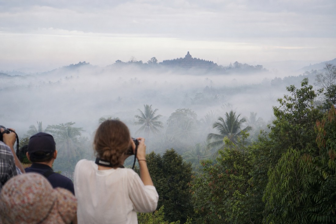 Morning mist over the Kedu Plain with Borobudur temple emerging, seen from Punthuk Setumbu