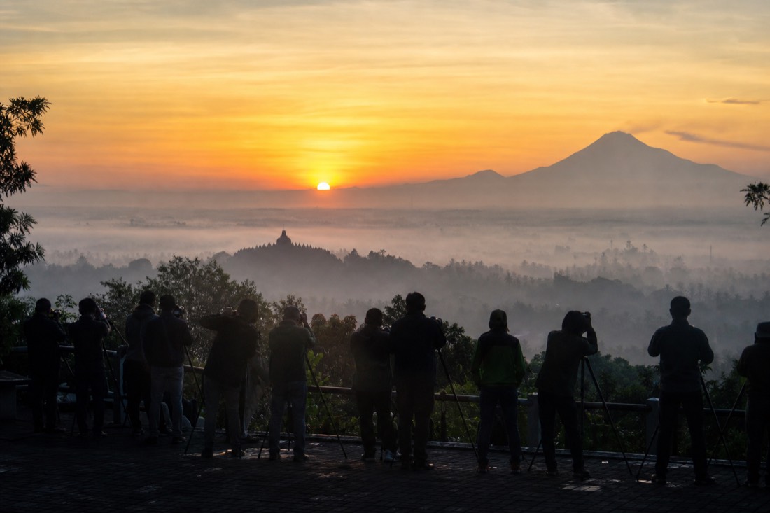 Dawn from Punthuk Setumbu hill: Borobudur temple silhouetted above the mist across the Kedu Plain