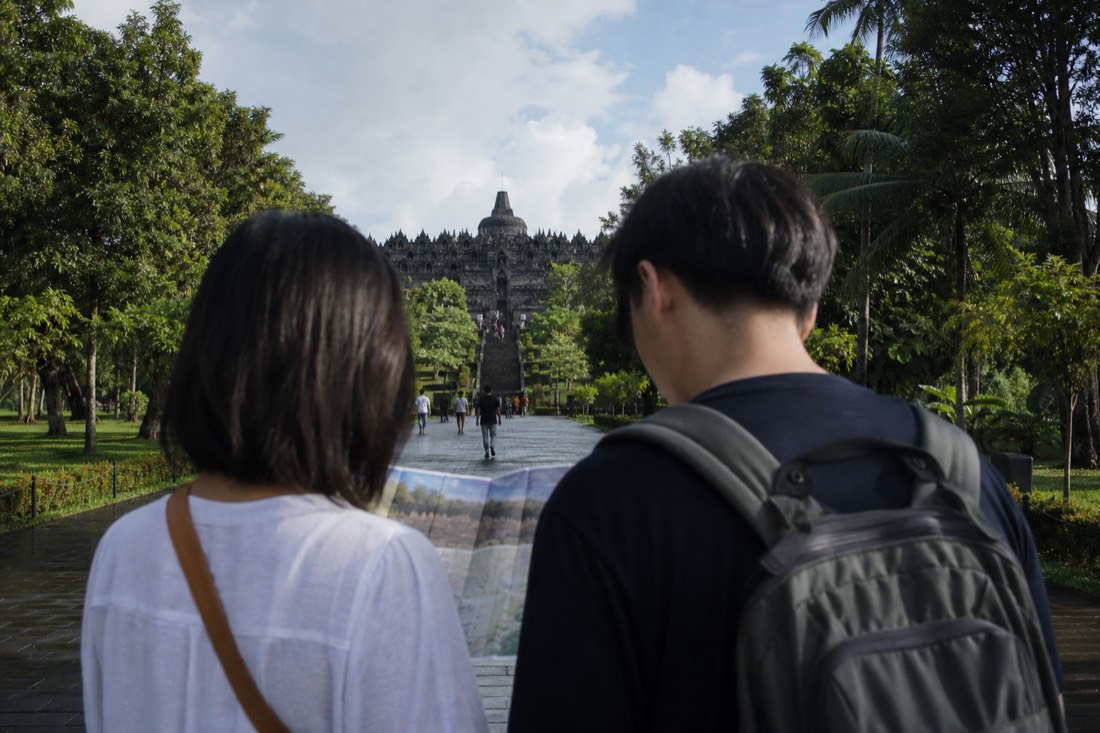 Travellers planning their route into Borobudur temple park
