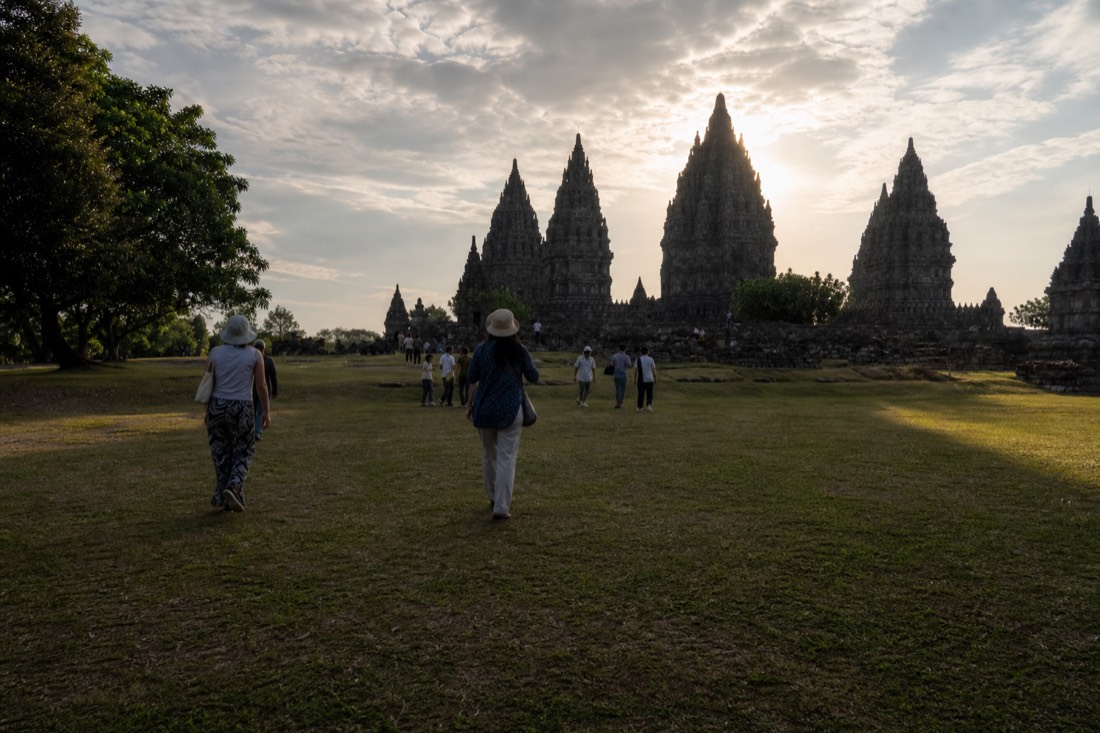 Golden hour across the lawns of Prambanan