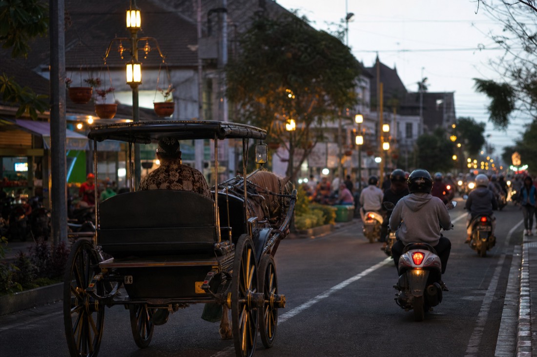 A horse cart on a Yogyakarta street at dusk