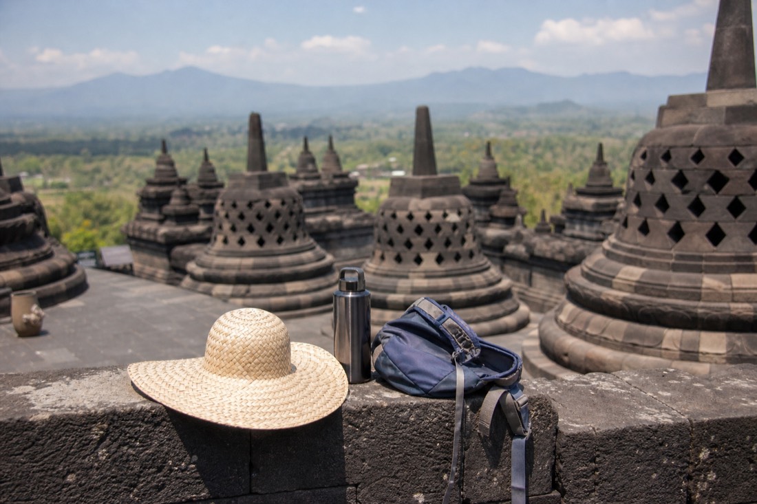 What visitors carry onto Borobudur: hat, daypack, water