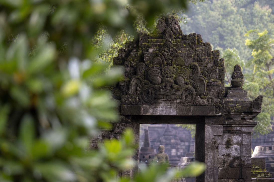 Carved kala head above a gateway of Borobudur temple